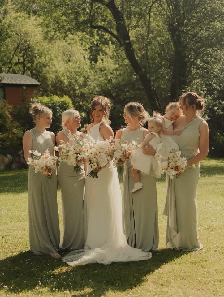 Bride, bridesmaids and flower girls with outdoor wedding hairstyles