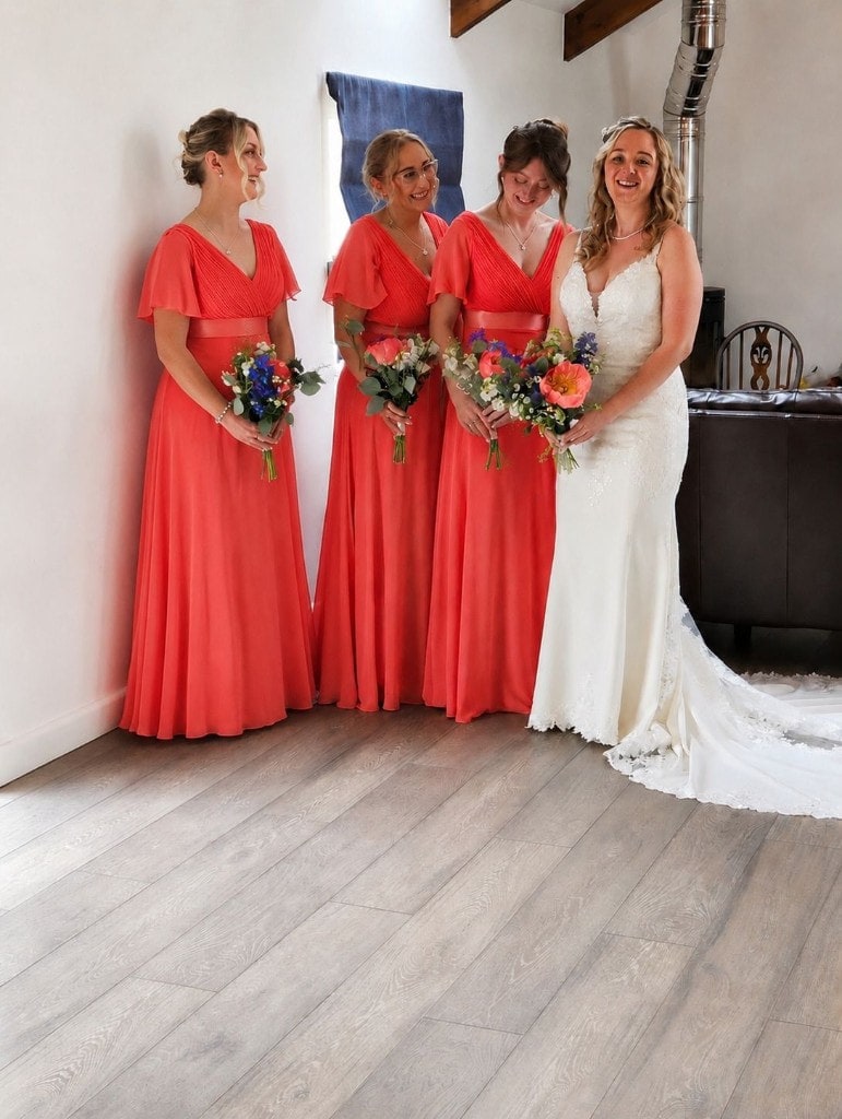 Bride and bridesmaids with coordinated wedding hairstyles